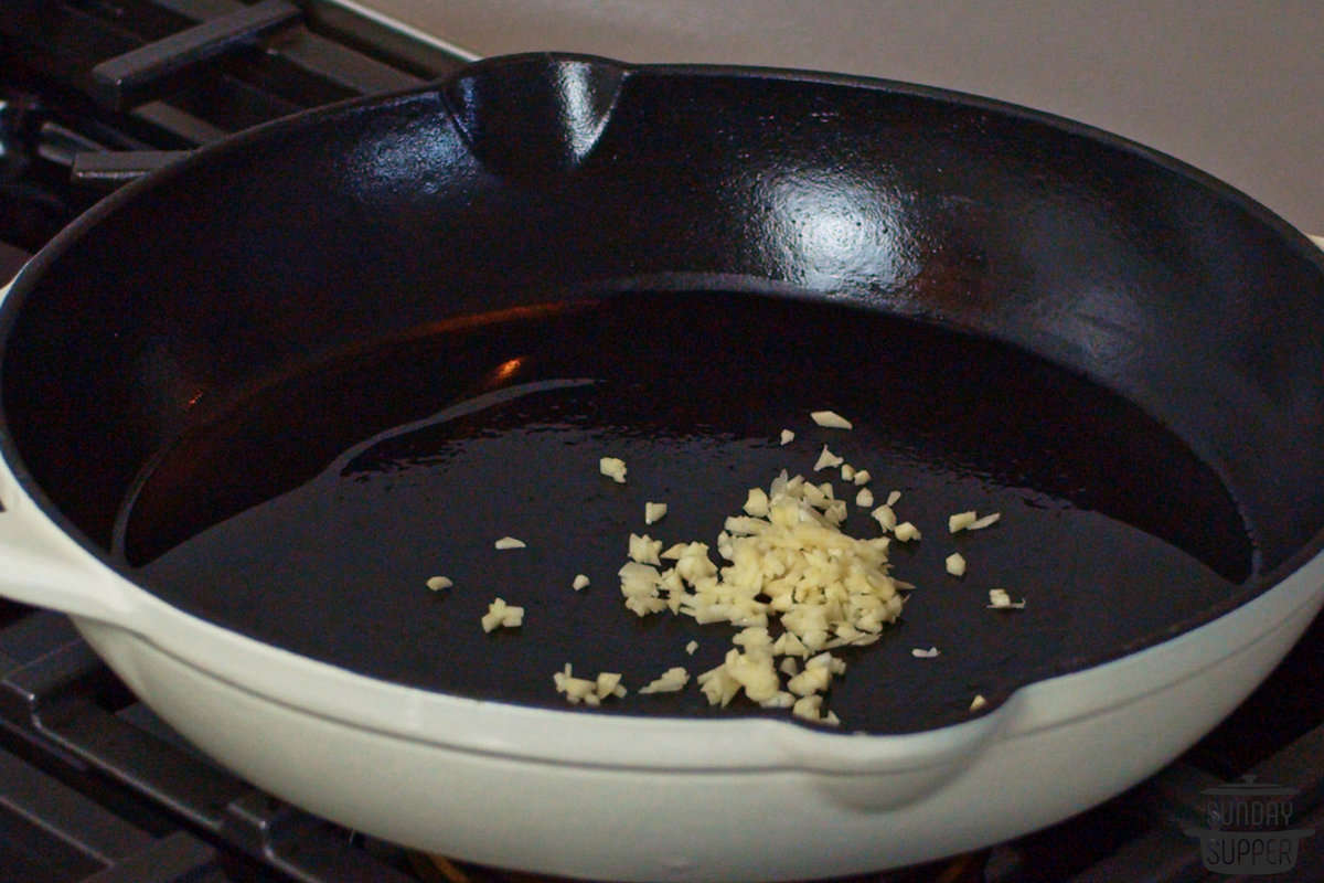 sautéing garlic in a skillet