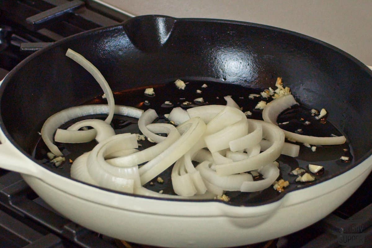 sautéing garlic and onions in a skillet