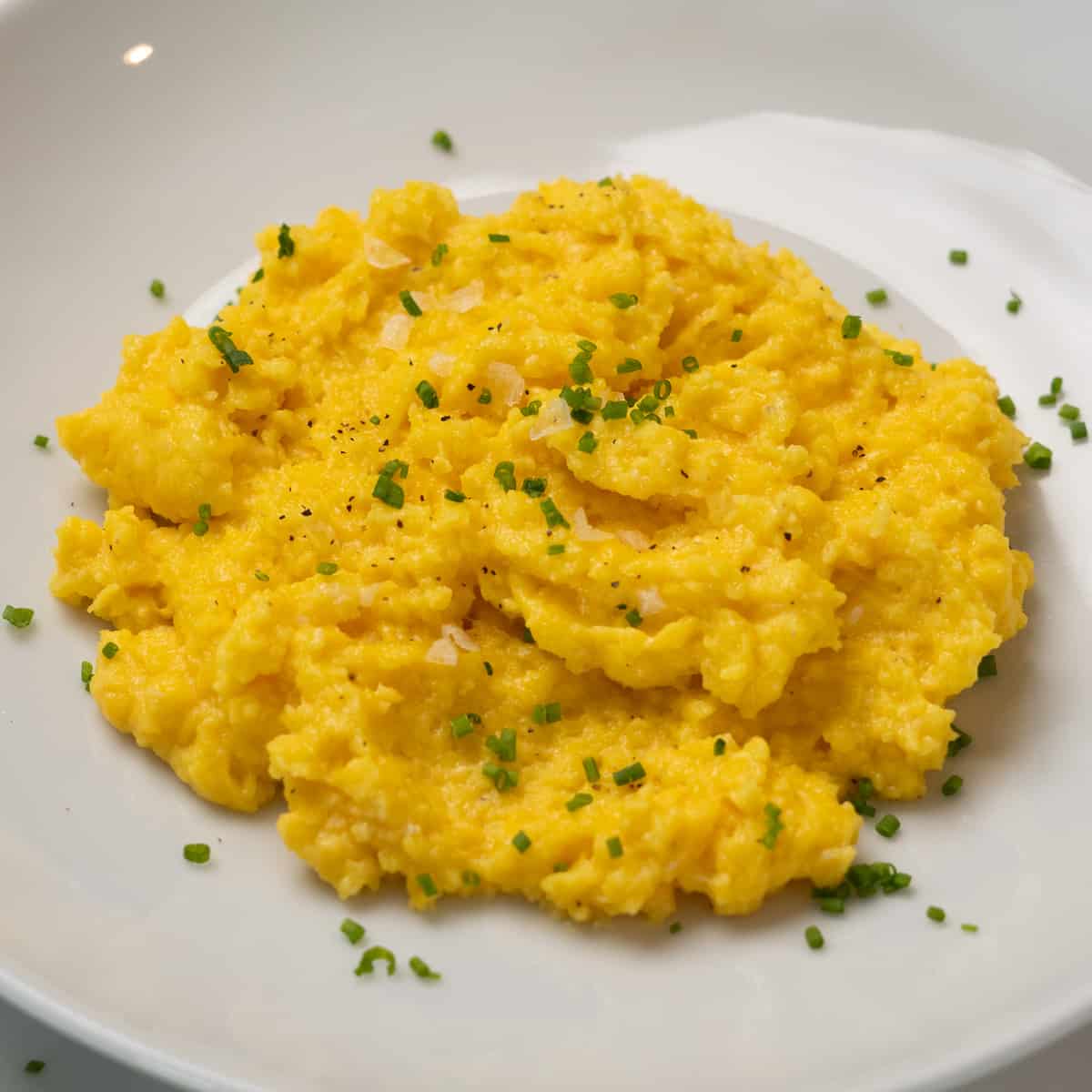 a closeup of a plate of scrambled eggs