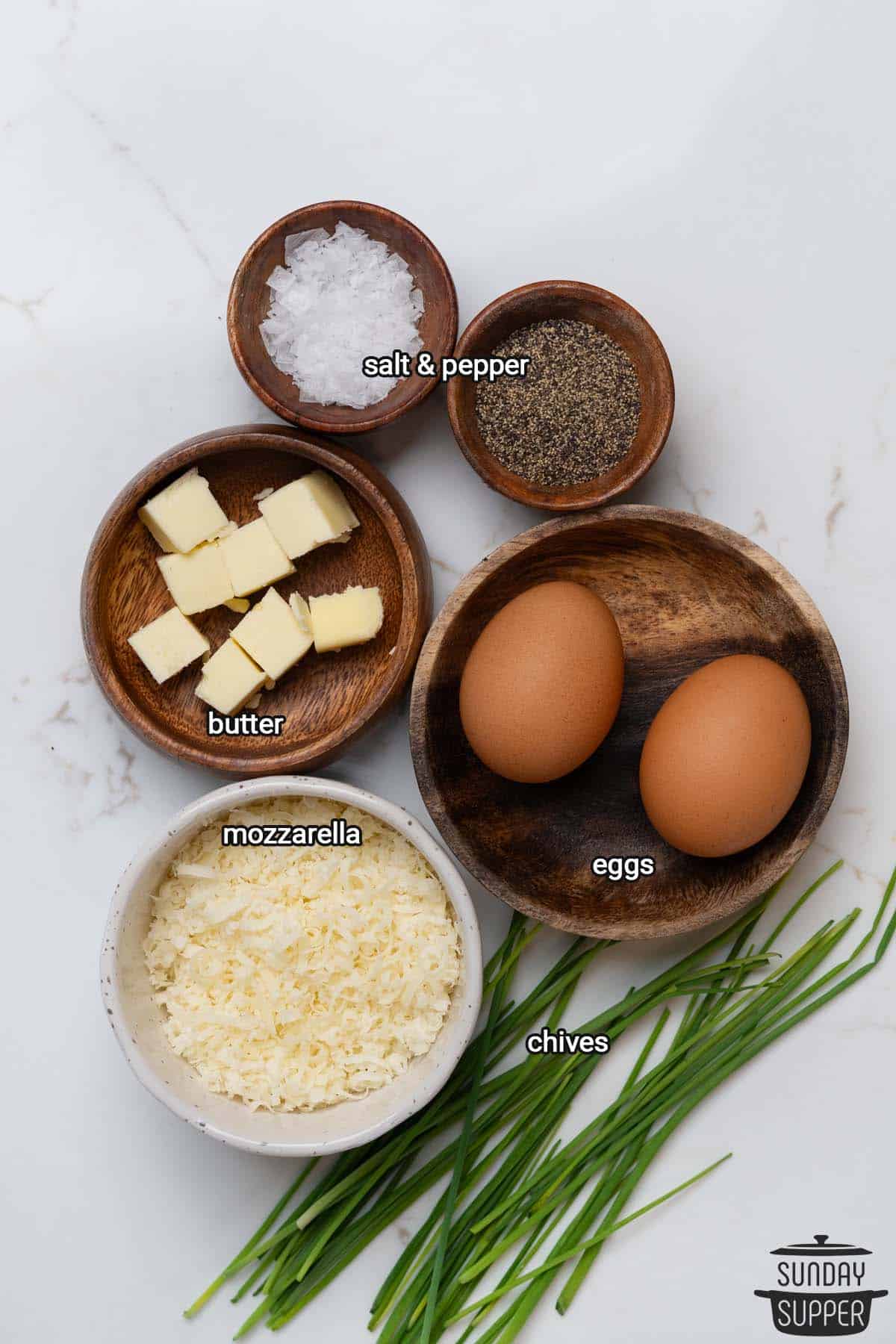 all the ingredients for creamy scrambled eggs with labels