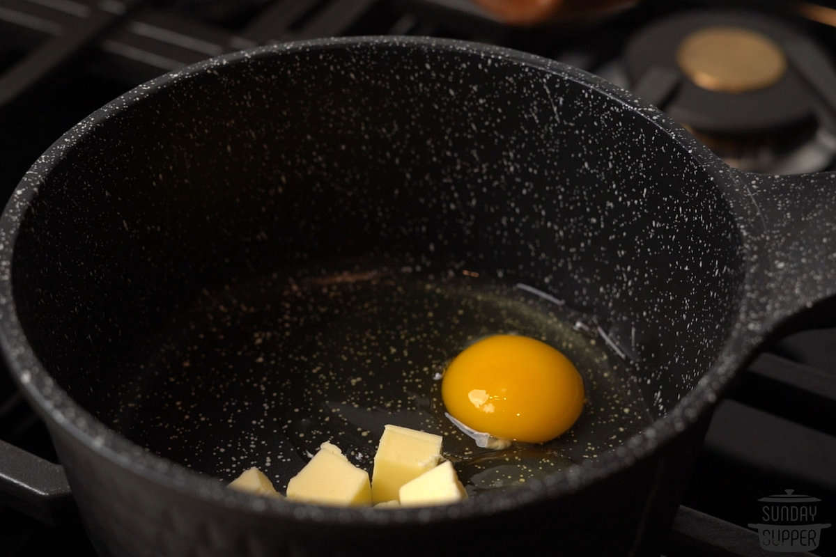 the eggs and butter added to a pan