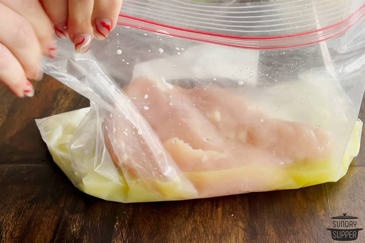 the pickle juice and milk in a bag with the chicken added