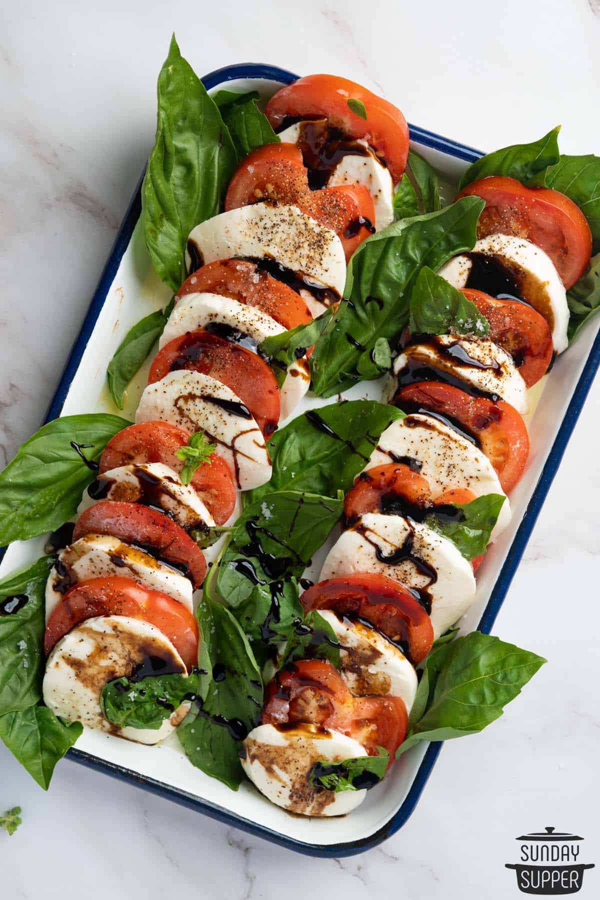 a completed serving dish of caprese salad