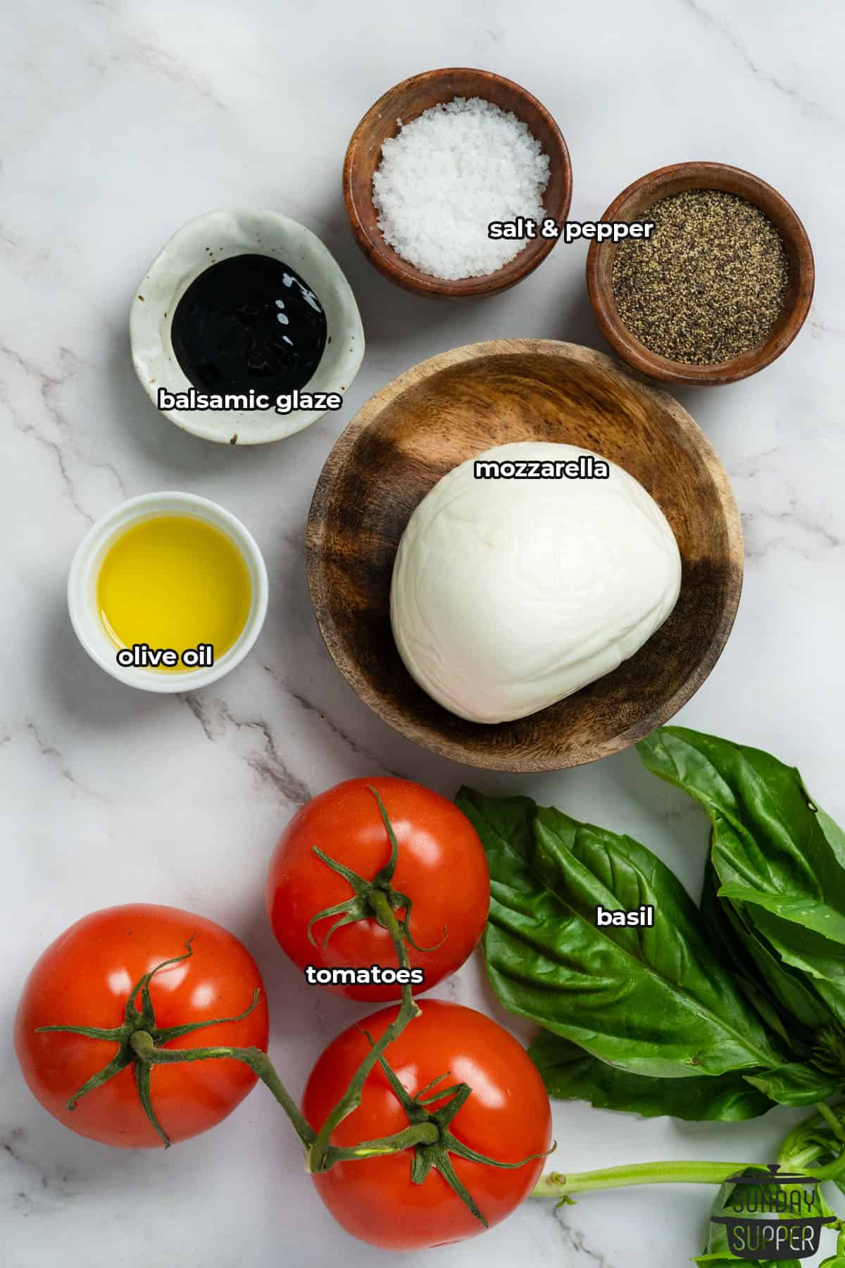 all the ingredients for tomato mozzarella salad with labels