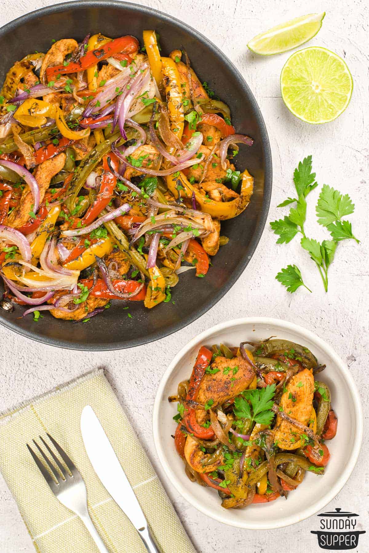 chicken fajitas in a pan and serving bowl