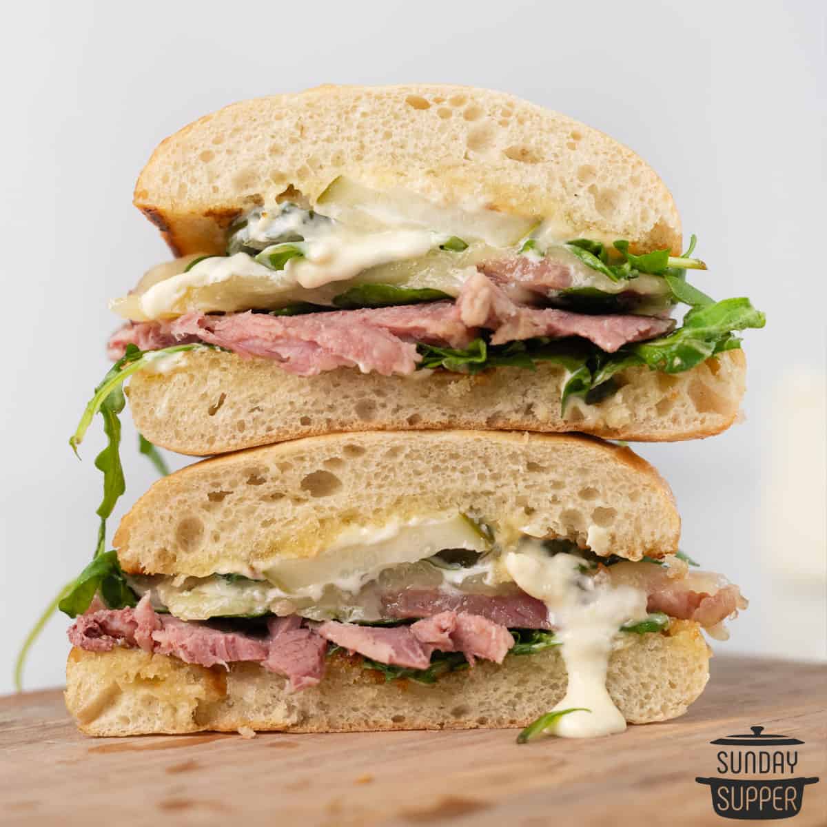 sliced corned beef sandwich on a cutting board