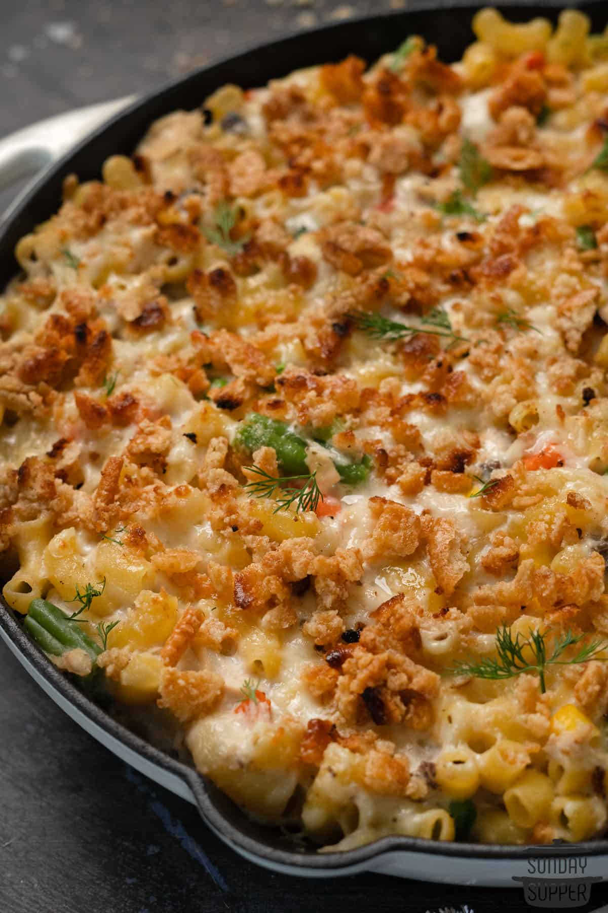 baked tuna noodle casserole in a cast iron pan