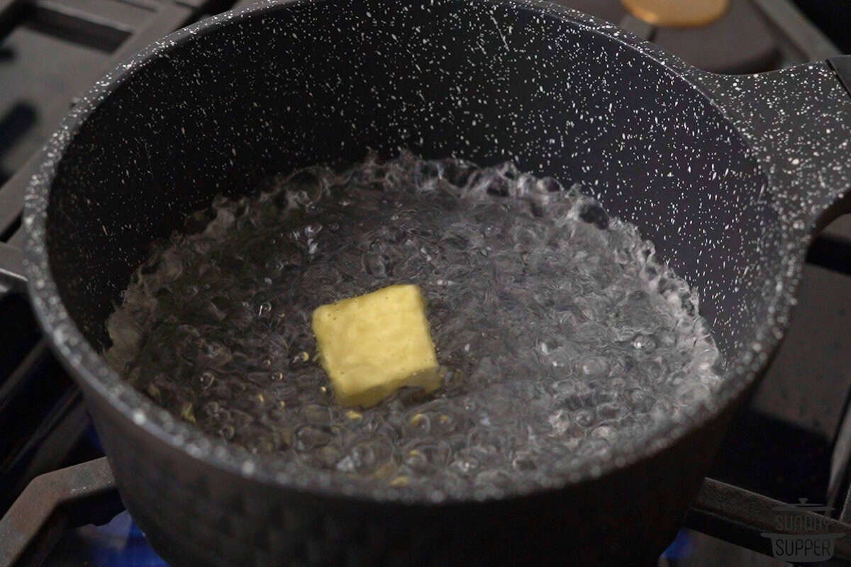 the water boiling with butter and salt added