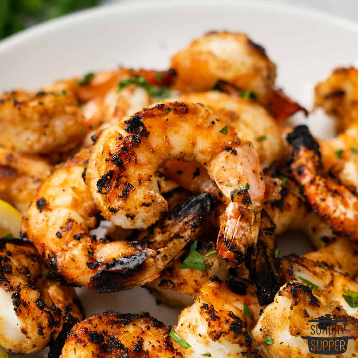 grilled shrimp covered with herbs