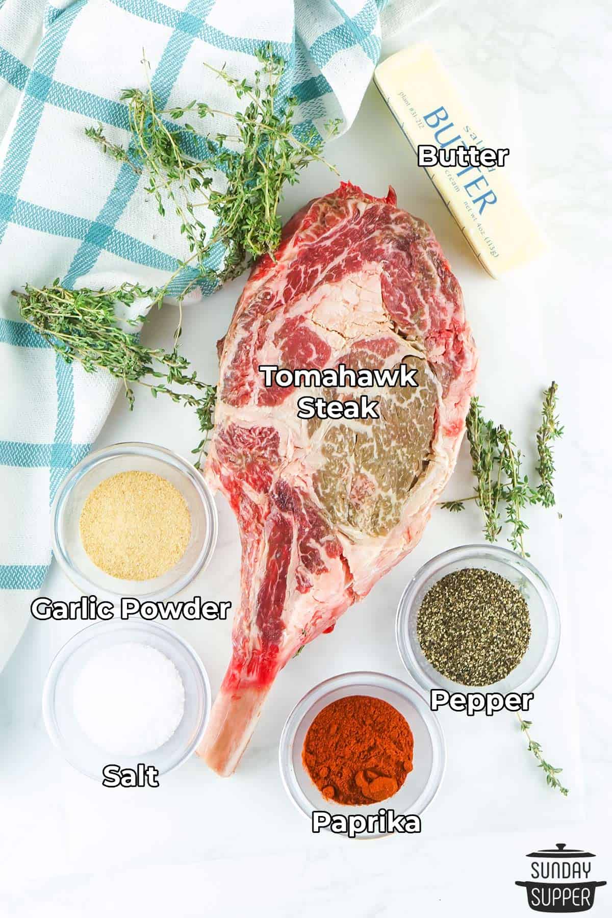 all the ingredients for tomahawk steak with labels