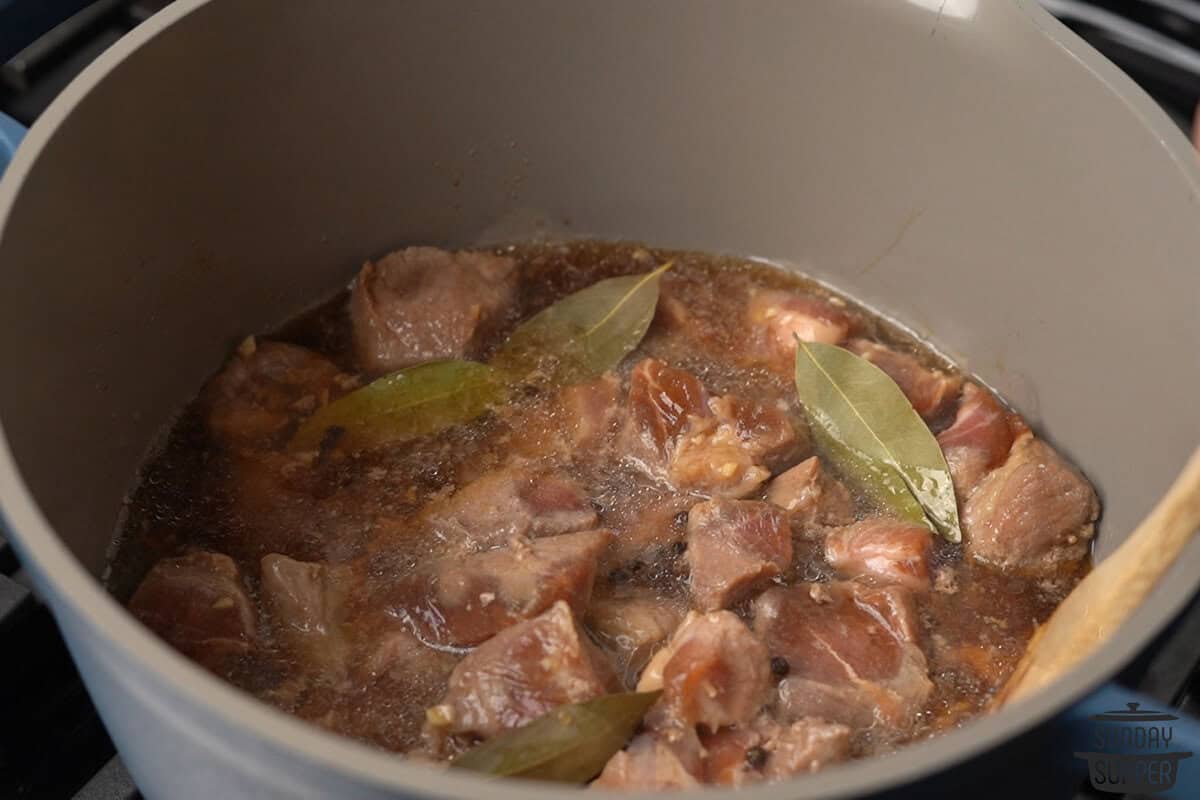 the pork being simmered in broth