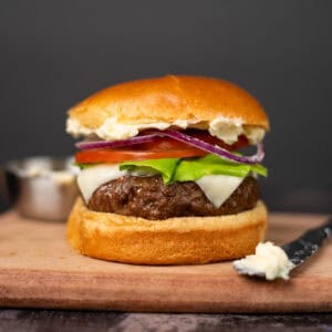 close up of air fryer burger on a cutting board