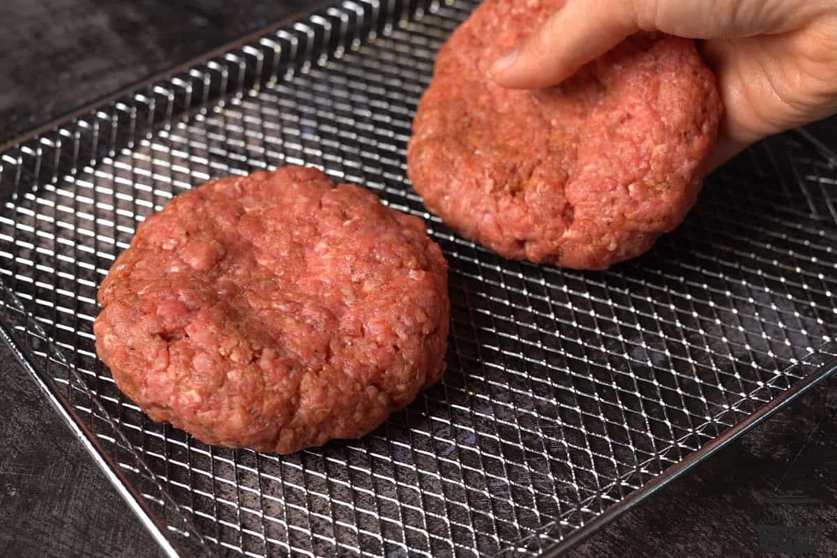 adding patties to the air fryer