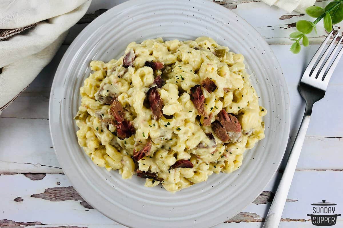 a bowl of brisket mac on a plate