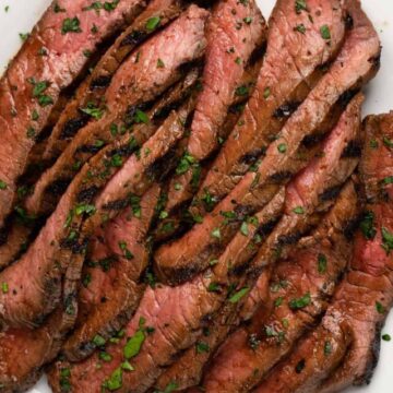 london broil slices on a white plate