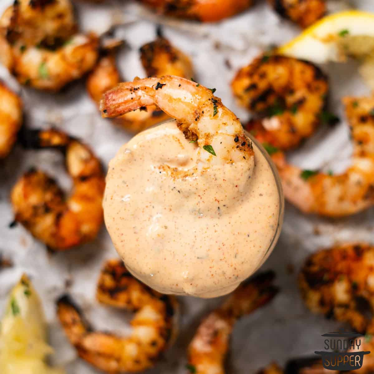 a grilled shrimp dipped in remoulade sauce