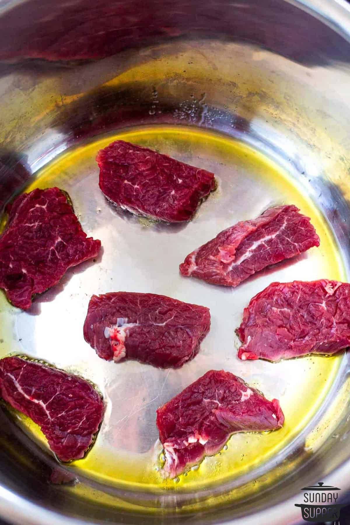 beef being sauteed in the instant pot