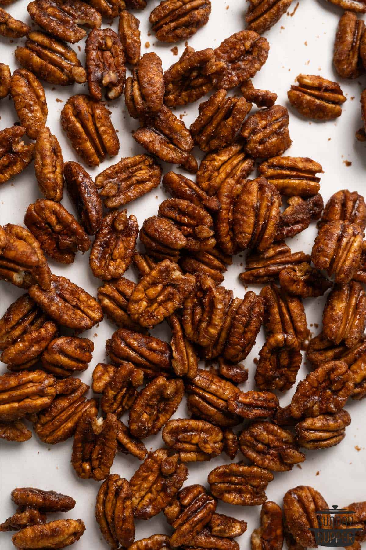 candied pecans on a baking sheet