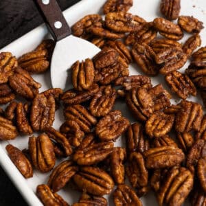 candied pecans on a baking sheet