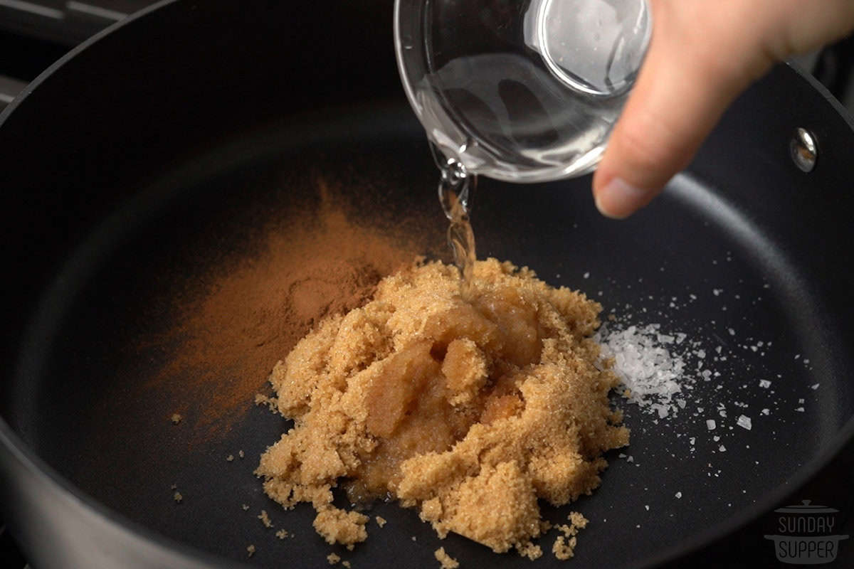 all the ingredients for the cinnamon sugar sauce added to a pan