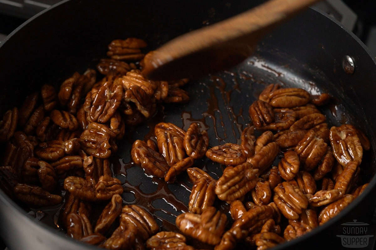 nuts added to the pot and coated in sugar sauce