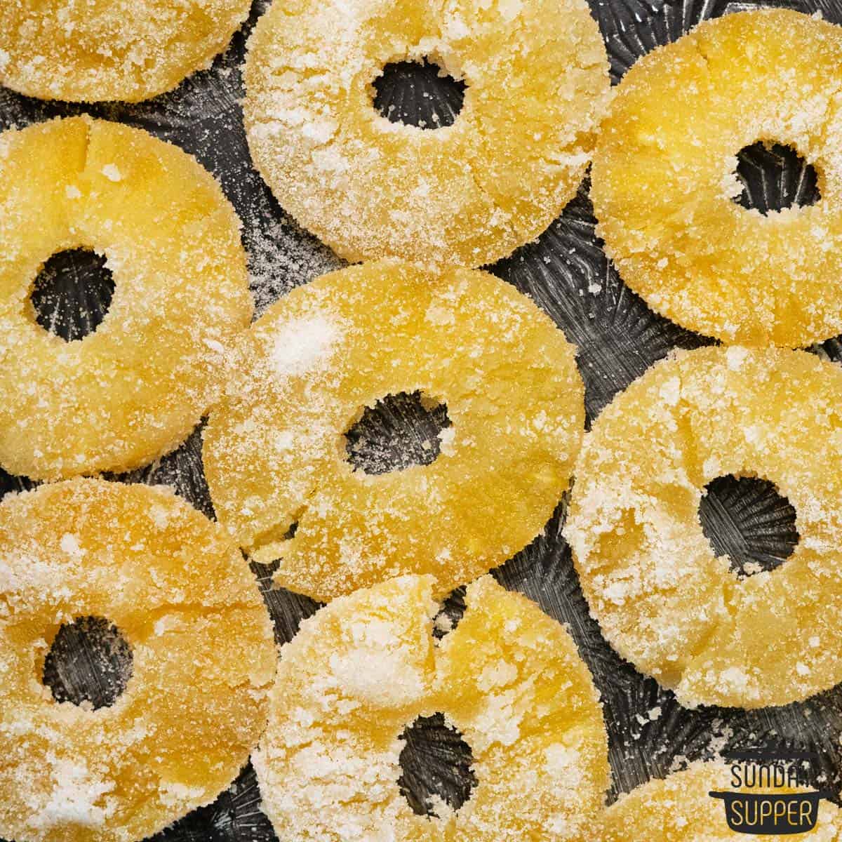 rings of candied pineapple on a tray