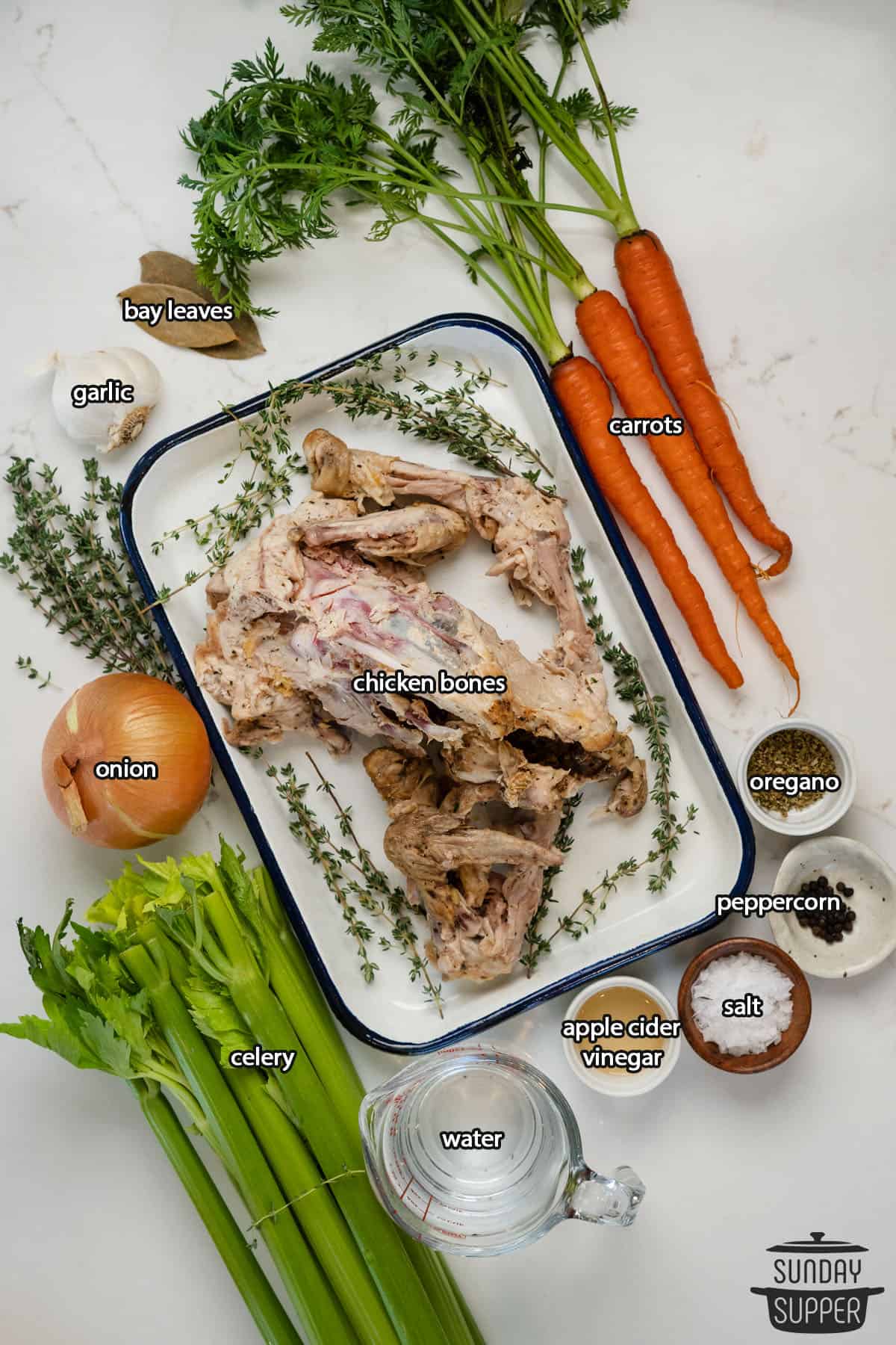 all the ingredients for chicken bone broth with labels