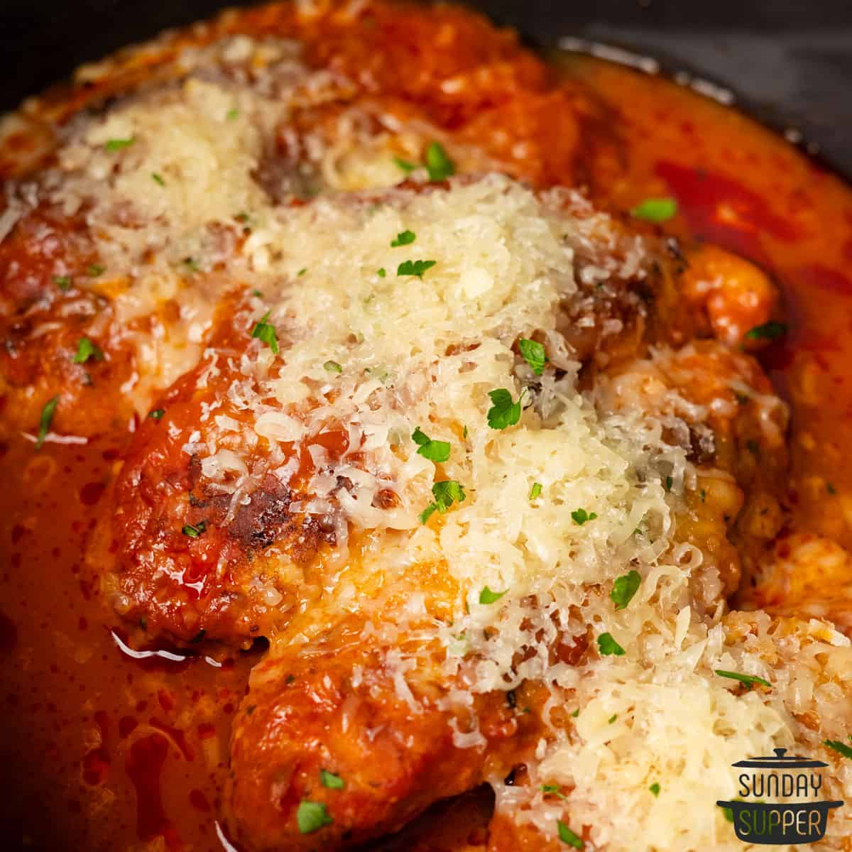 chicken parm in the slow cooker with cheese on top