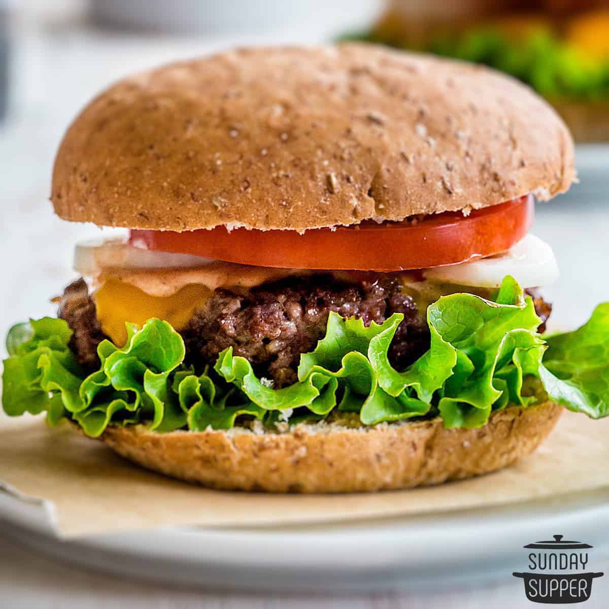 a completed smash burger on a plate