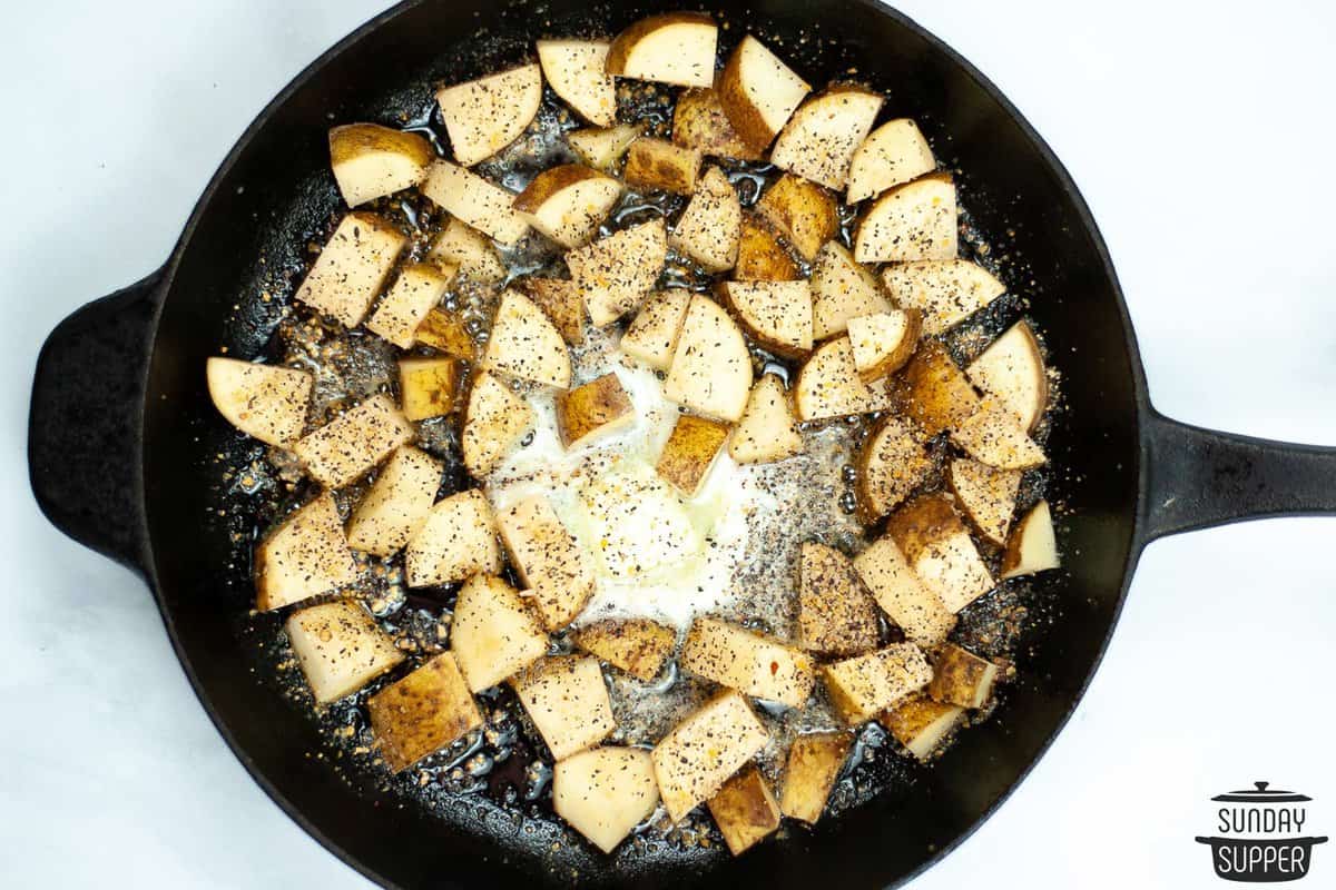 the rest of the butter and the potatoes added to the pan to cook