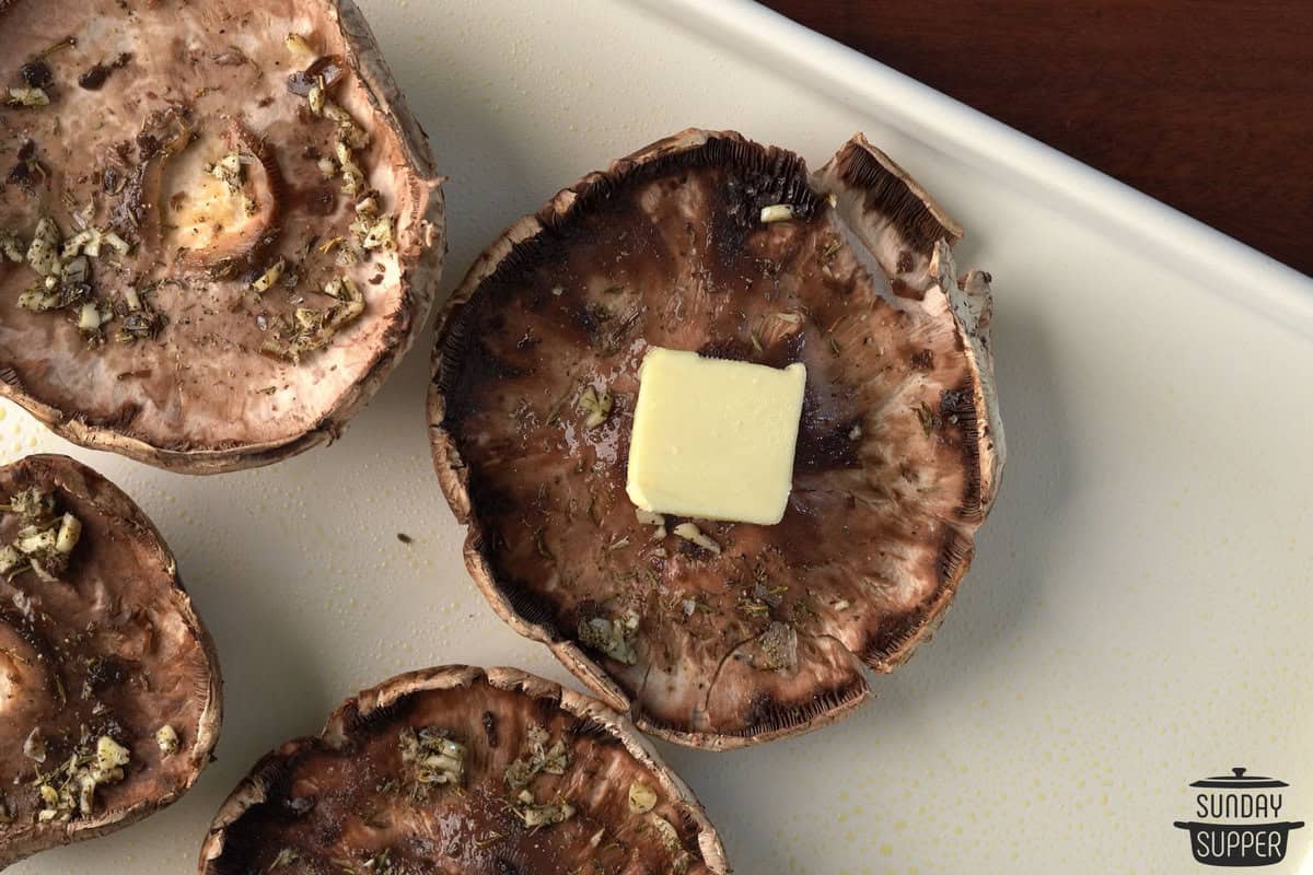 seasoning and butter on mushrooms