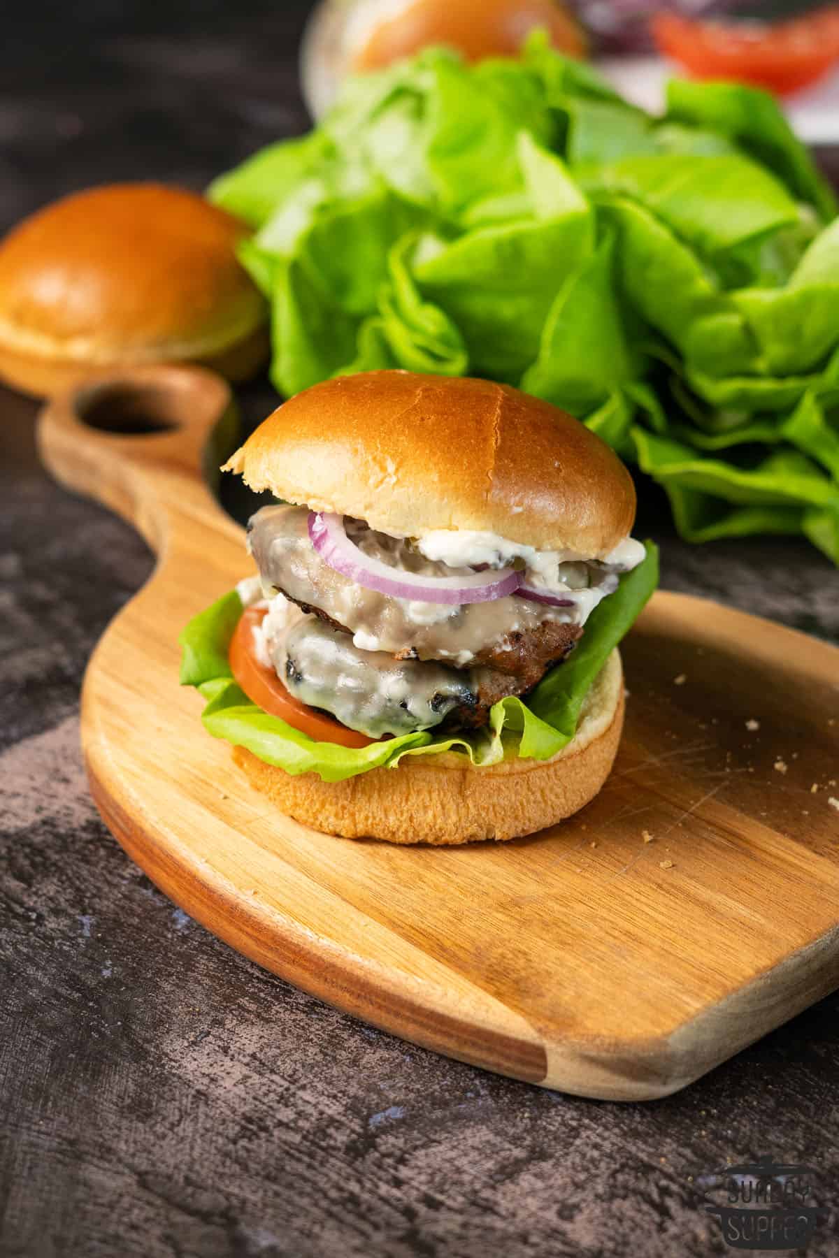 a double layer turkey burger on a cutting board