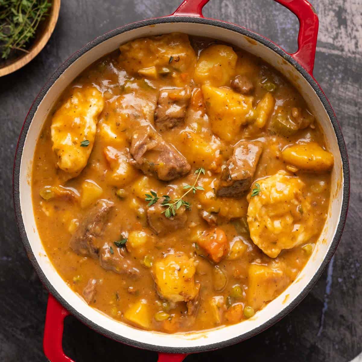 completed beef stew and dumplings in a pot