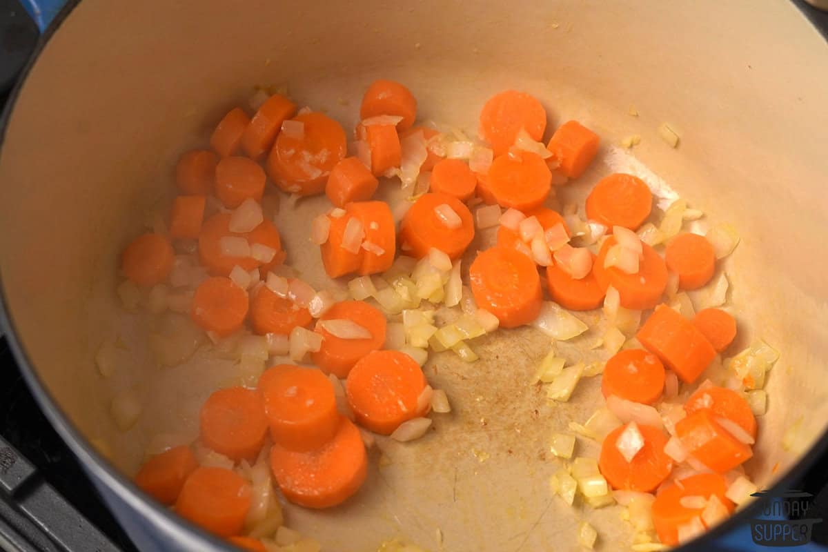 carrots, onions, and garlic cooked down in the pot