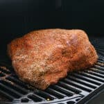 seasoned beef brisket in smoker