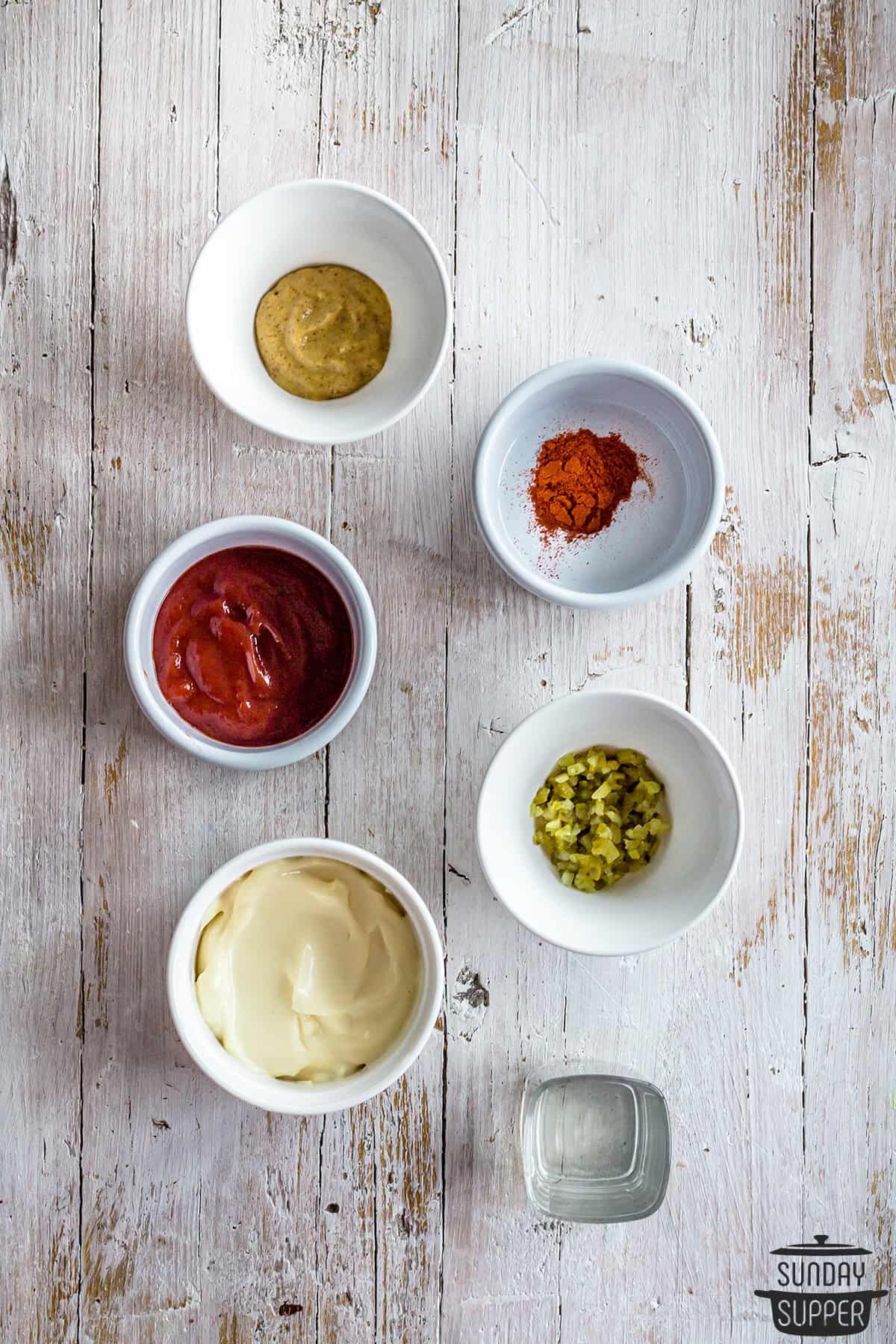 ingredients to make burger sauce in bowls