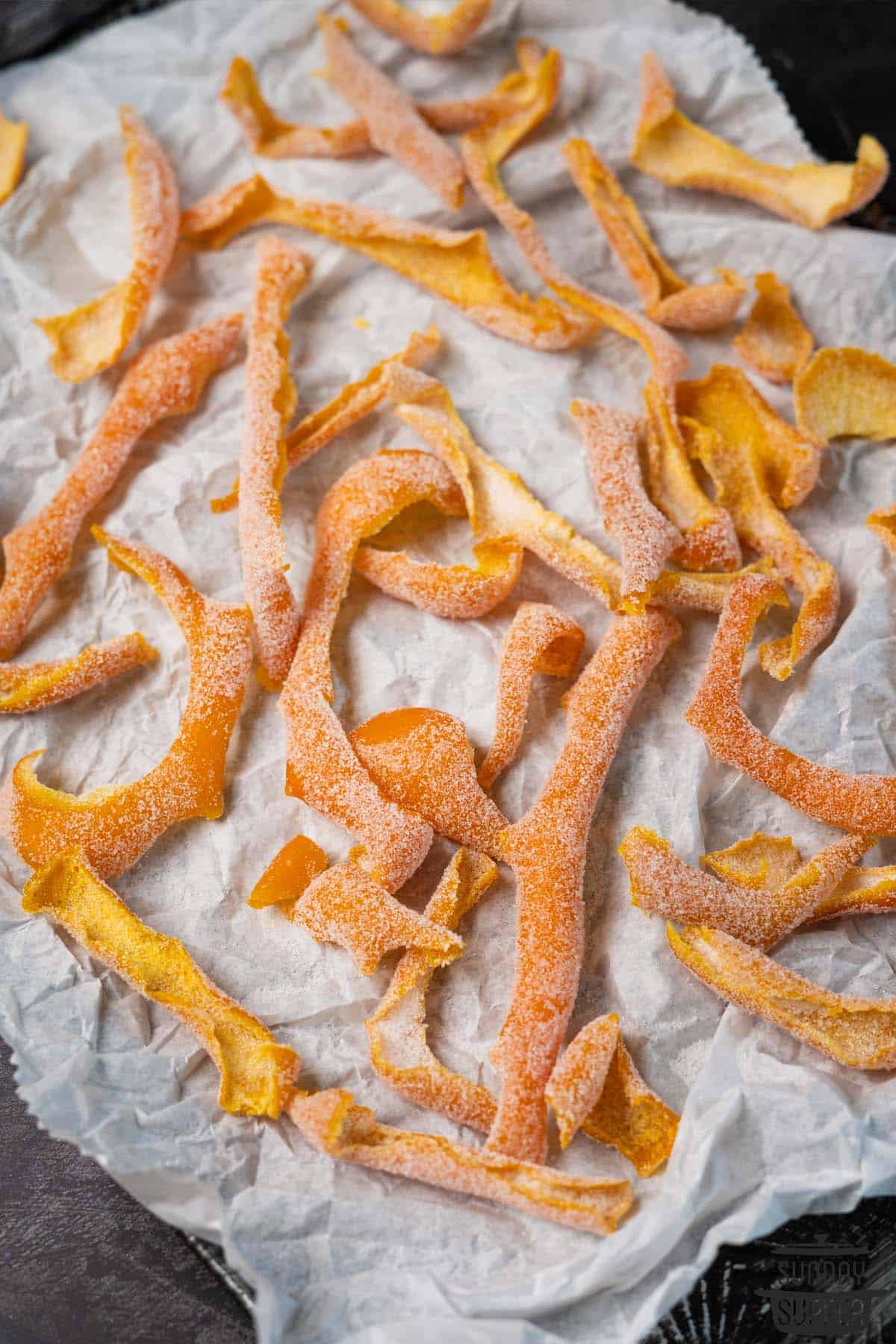 a tray filled with sugar coated orange peel