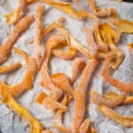 a closeup of candied orange peel coated with sugar