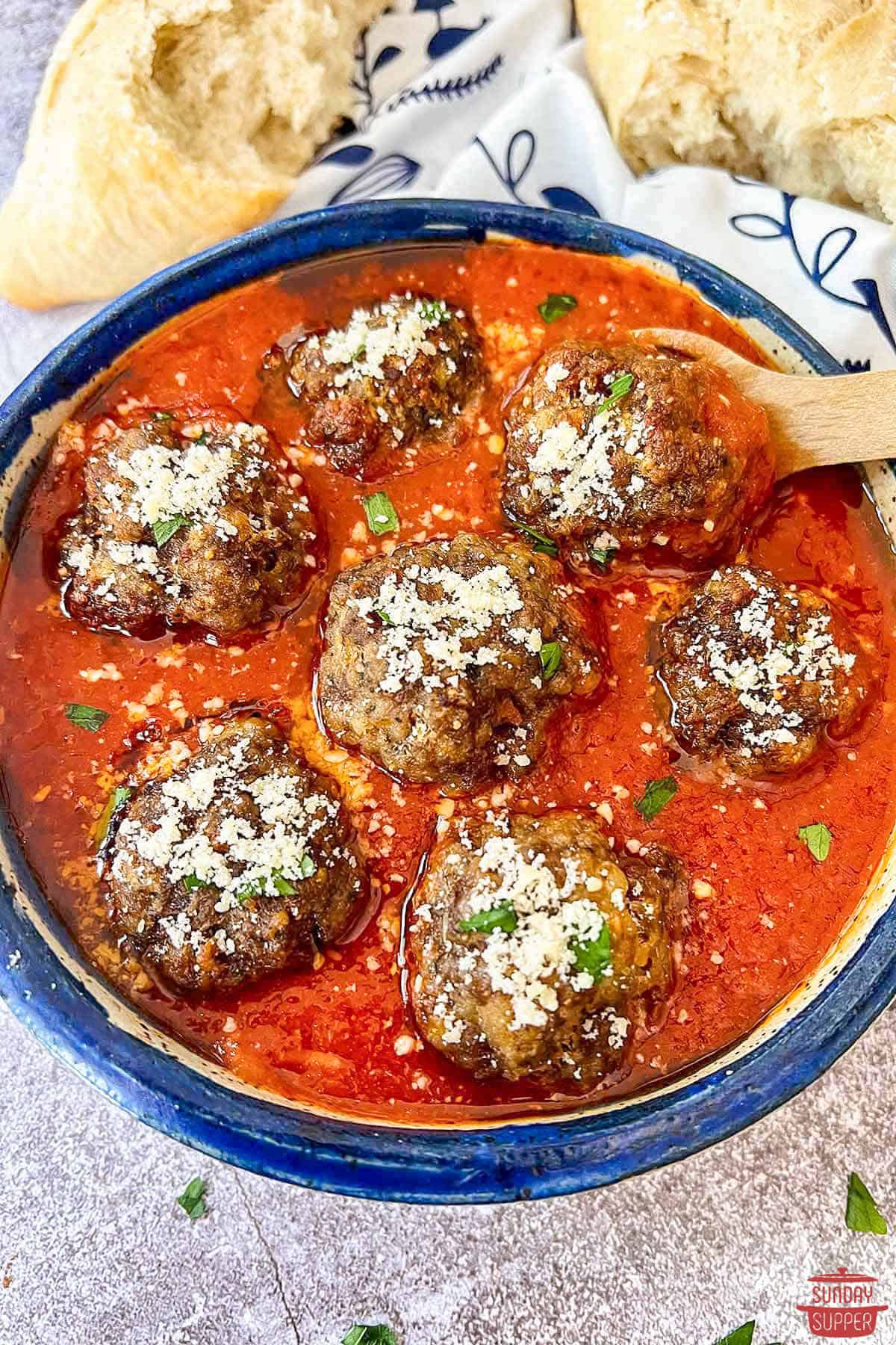 italian meatballs in a bowl with a spoon