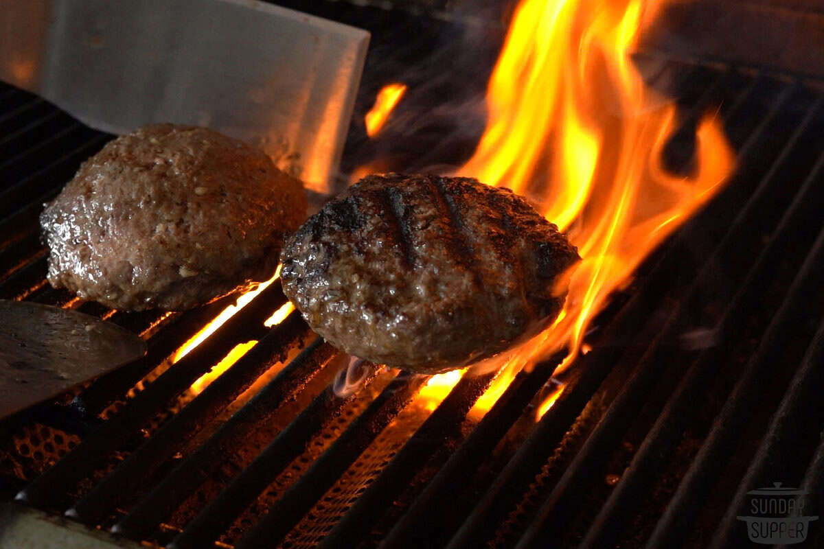 juicy lucy burgers on the grill