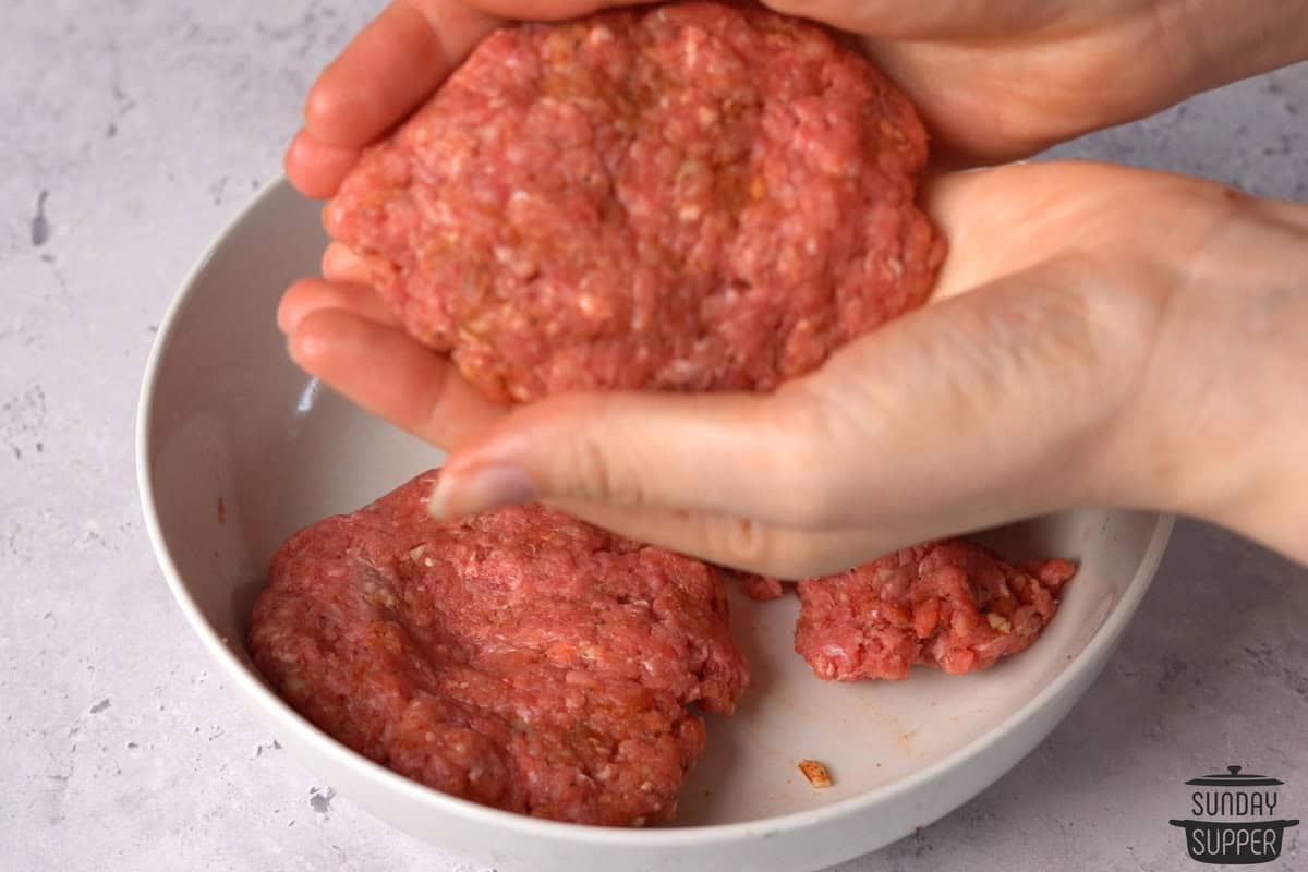 hands forming a patty from the hamburger mixture