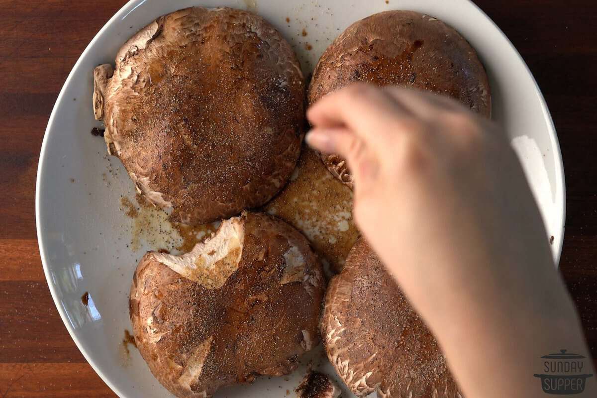 the seasonings being added to the mushrooms