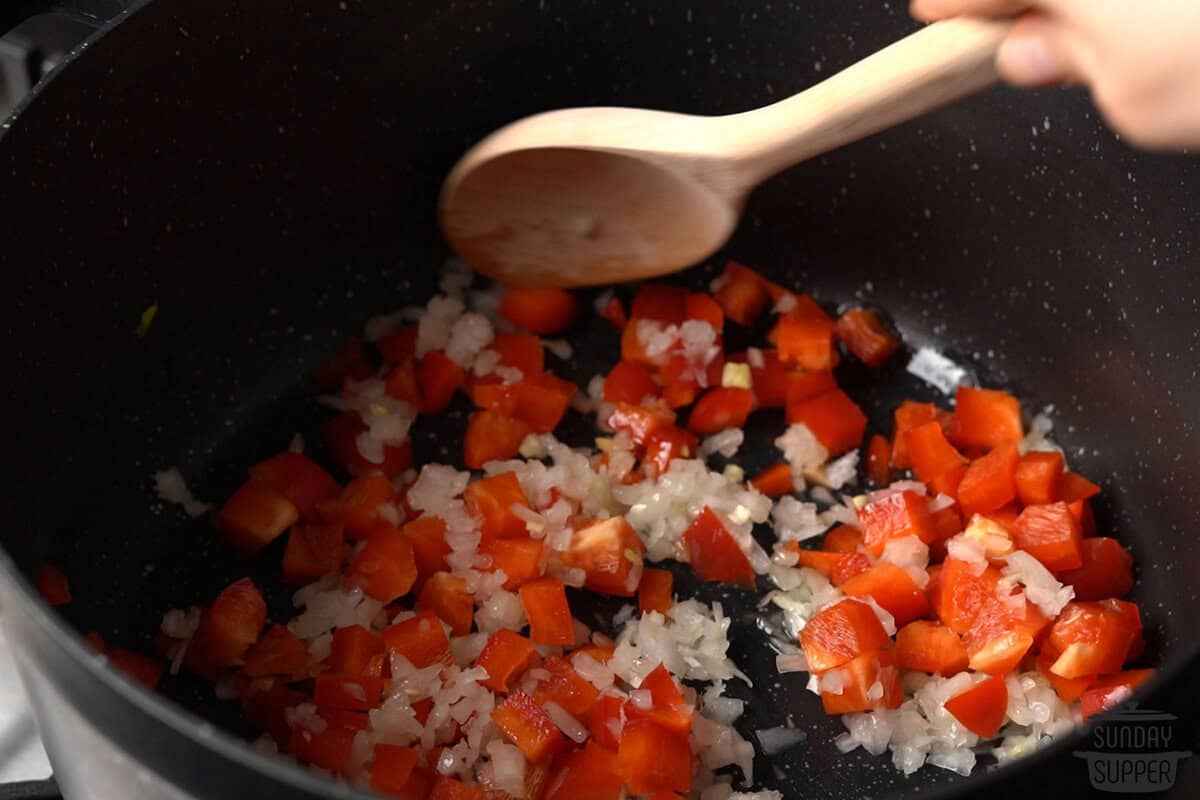 the vegetables being sauteed in the pan