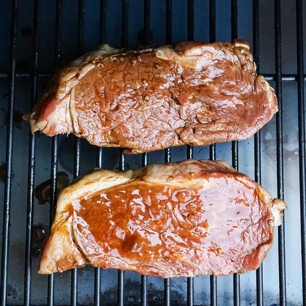 asian marinated steaks on a grill