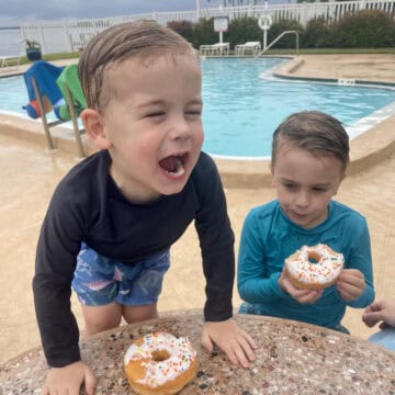 rory and aiden at the pool with donuts