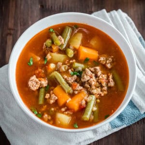 a closeup of hamburger soup in a bowl