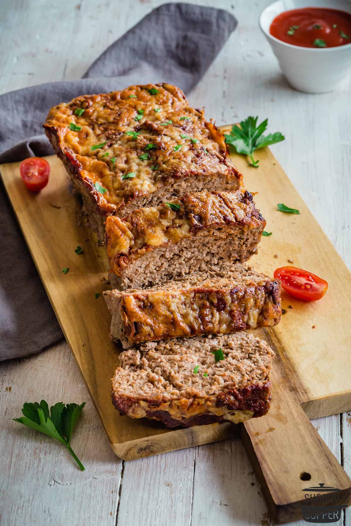 slices of keto meatloaf on a cutting board