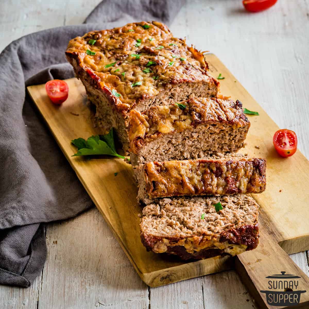 keto meatloaf close up on a cutting board sliced