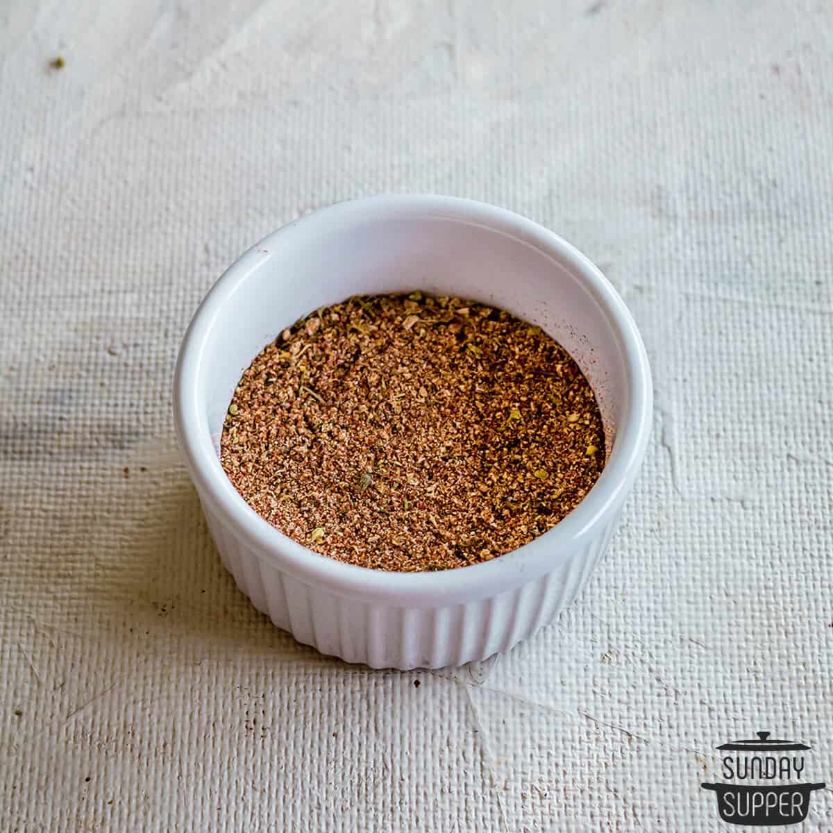 meatloaf seasoning up close in a white ramekin