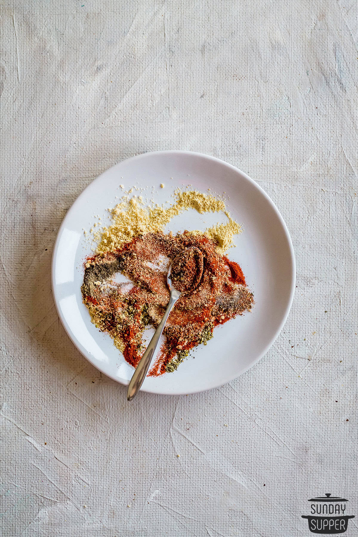 meatloaf seasoning ingredients mixing together on a plate